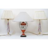 A pair of modern Italian Mangani ceramic table lamps, each with tapering shaft, decorated with tr...