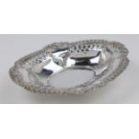 An Edwardian silver pierced oval dish, Birmingham, 1901, maker's mark rubbed, having scalloped ed...