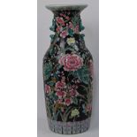 A large Chinese famille noir vase, late 19th / early 20th century, of baluster form, decorated wi...