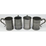 Four pewter quarts, 18th / 19th century, each with scrolling handles and stamped QUART near the r...
