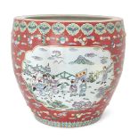 A large Chinese famille rose fish bowl, early 20th century, enamelled with panels depicting 'bai ...