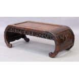 A Chinese Hongmu Kang low table, late 19th century, the scroll ends with floral carvings and flor...