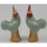 A pair of Chinese porcelain celadon roosters, Republic period, with red painted comb and wattles,...