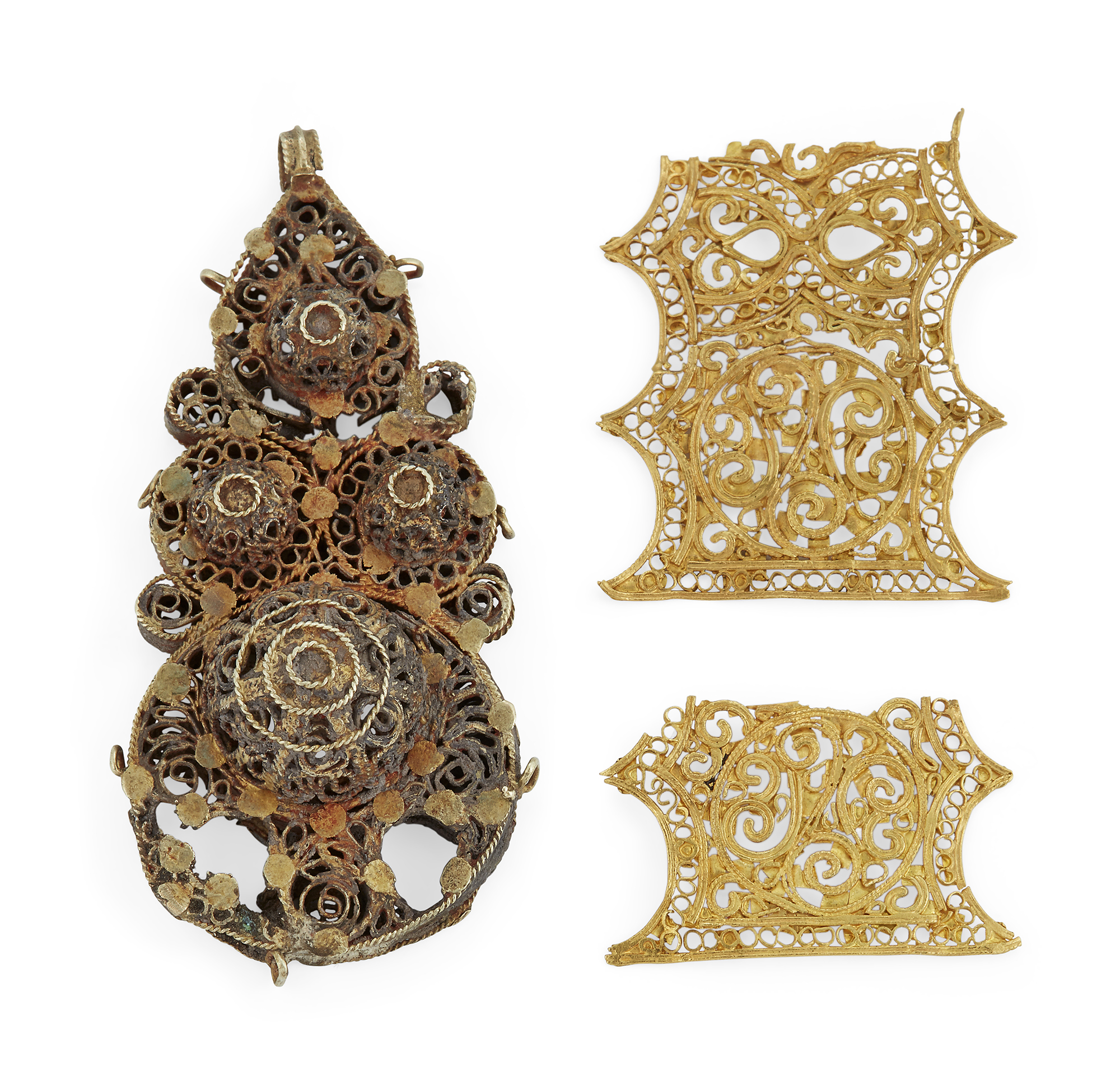 A Group of Important Works - To be sold Without Reserve Two Fatimid openwork jewellery elements,...