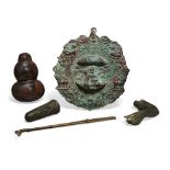 A Nepalese bronze mandarla, 20th century, 21.3cm. high; a tiered bronze globular weight, 14.5cm. ...