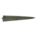 A heavy Bronze Age bronze short sword with leaf-shaped blade and pronounced midrib, cylindrical s...