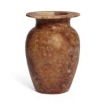 An alabaster jar, of baluster form, with wide everted rim, 15.2 cm high