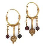 A Group of Important Works - To be sold Without Reserve A pair of gold and garnet earrings in th...