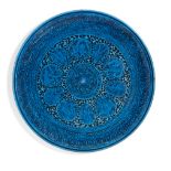 A pottery plate in the Qajar style, Germany or France, 19th century, turquoise glazed, the centra...