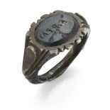 A Roman silver ring with broad engraved shank, the green bezel engraved with lettering, circa 3rd...