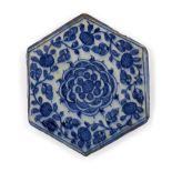 A Mamluk tile hexagonal pottery tile, Syria, early 15th century, the cobalt-blue decoration with ...