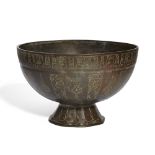 An engraved Khorassan footed bowl, Persia, 13th century, on an octagonal foot, with deep bowl, en...