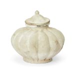 A small Thai Sawankhalok white-glazed jar and cover 14th/15th century  Of lobed globular form, ...