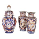Three Japanese Imari vases 20th century The pair painted with panels of birds perched amongst b...