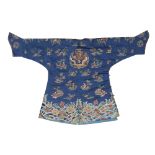 A Chinese blue silk embroidered 'dragon' child's robe Late Qing dynasty With a three-clawed dra...