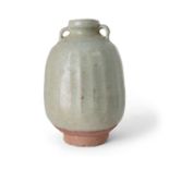 A Thai Sawankhalok celadon-glazed fluted jar with paired lug handles 14th/15th century Carved w...