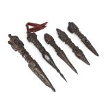 Five Himalayan region wood ritual daggers, phurba Possibly 19th century Comprising: A dagger wi...