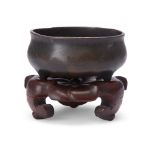 A Chinese bronze small tripod incense burner Ming dynasty, 17th-18th century of typical bombe f...