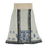 A Chinese silk embroidered pale blue ground skirt Qing dynasty, late 19th century The pale blue...