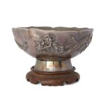 A Japanese silver 'dragon' bowl  Meiji period Jungin (pure silver) mark to base, of lobed form,...