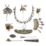 A group of Chinese kingfisher feather jewellery and a silver nail guard-shaped brooch Late Qing ...