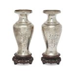 A pair of Japanese silver vases  Meiji period, 19th/20th century Of baluster form, incised with...