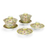 A pair of Chinese famille rose yellow-ground 'Wan Shou Wu Jiang' bowls, covers and stands, and a ...