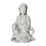 A large Chinese blanc-de-chine figure of Guanyin 20th century Modelled seated wearing flowing r...