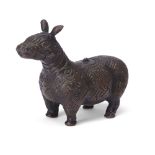 A Chinese archaistic bronze figure of a tapir 20th century Standing four-square and covered in ...