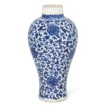 A Chinese blue and white soft paste vase Qing dynasty, 18th century Of tapered baluster form ri...