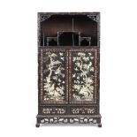A Chinese rosewood display cabinet,  Qing Dynasty, 19th century with carved simulated bamboo fr...