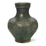 A Chinese lead green-glazed moulded vase Han dynasty Moulded around the shoulder with a border ...
