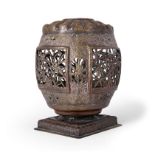 A Chinese brass lantern Qing dynasty, 19th century Of barrel form decorated with pierced cartou...