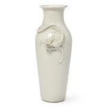 A Chinese blanc-de-chine 'dragon' vase Late Qing dynasty Of baluster form, applied with a drago...