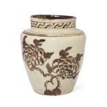 A Chinese Cizhou jar Ming dynasty Of ovoid form, covered in a creamy white glaze brown painted ...