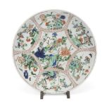A Chinese famille verte 'pheasant and flower' charger Qing dynasty, Kangxi period Painted to th...