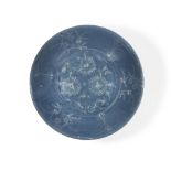 A large Chinese Zhangzhou (Swatow) slip-decorated blue-glazed dish Late Ming dynasty, Wanli peri...