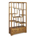 A Chinese elm asymmetrical etagere,  Republic period with arrangement of three tiers of shelves...