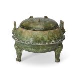 A Chinese green-glazed tripod ding and cover Han dynasty The domed cover with three lugs, the b...