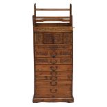 A Chinese softwood small cabinet Early 20th century with carved lion finials and pair of carved...