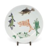 A large Chinese famille verte 'fish' plate Qing dynasty, Kangxi mark and of the period The roun...