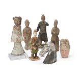 A group of Chinese pottery figures Han-Ming dynasty comprising a Ming sancai warrior, 24cm high...