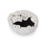 A small Chinese white-glazed ‘Buddhist lion’ ink pot Late Qing dynasty  Thinly potted as recumb...