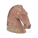 A Chinese grey stoneware model of a horse's head Han dynasty Covered in an ochre pigment with b...