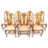 A set of seven Dutch marquetry inlaid walnut dining chairs, 18th century, including one armchair,...