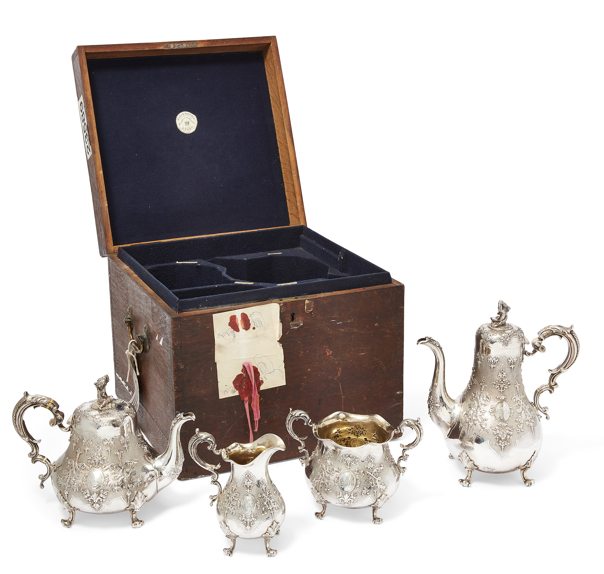 A four piece Victorian silver tea set, London, 1860, Robert Hennell III, in fitted Hunt & Roskell...