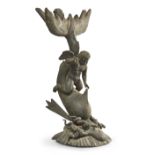 A Neapolitan bronze model of Eros riding a dolphin, early 20th century, the addorsed dolphin catc...