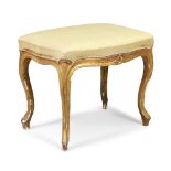 A George III giltwood stool, in the French taste, last quarter 18th century, the carved frame wit...