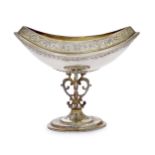 An Edwardian navette-shaped silver gilt bonbon dish on pedestal foot, London, 1905, John Bodman C...