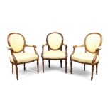 A set of three French mahogany fauteuils, in the Louis XVI style , third quarter 19th century, th...